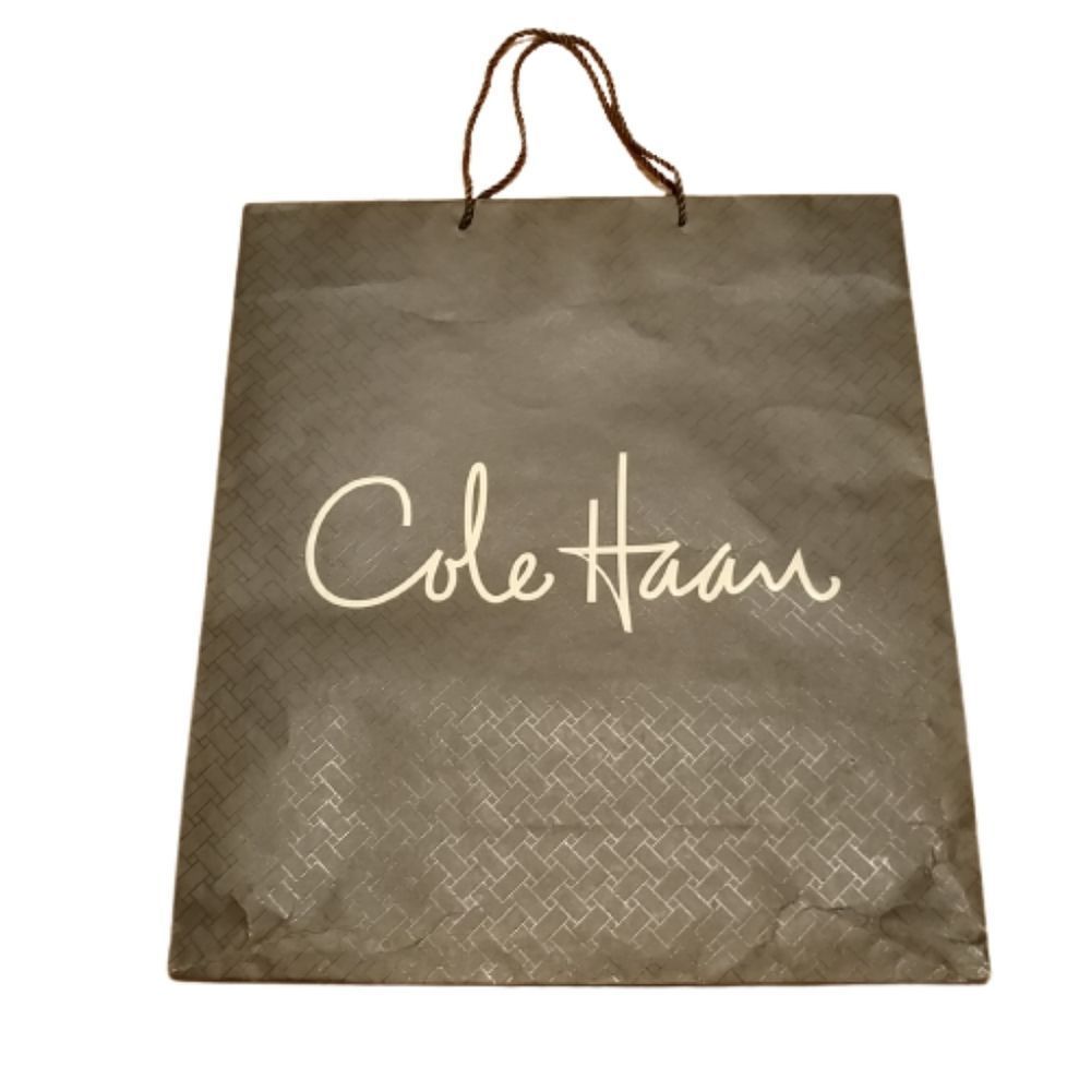 Free with purchase* | Cole Haan large paper gift or shopping bag